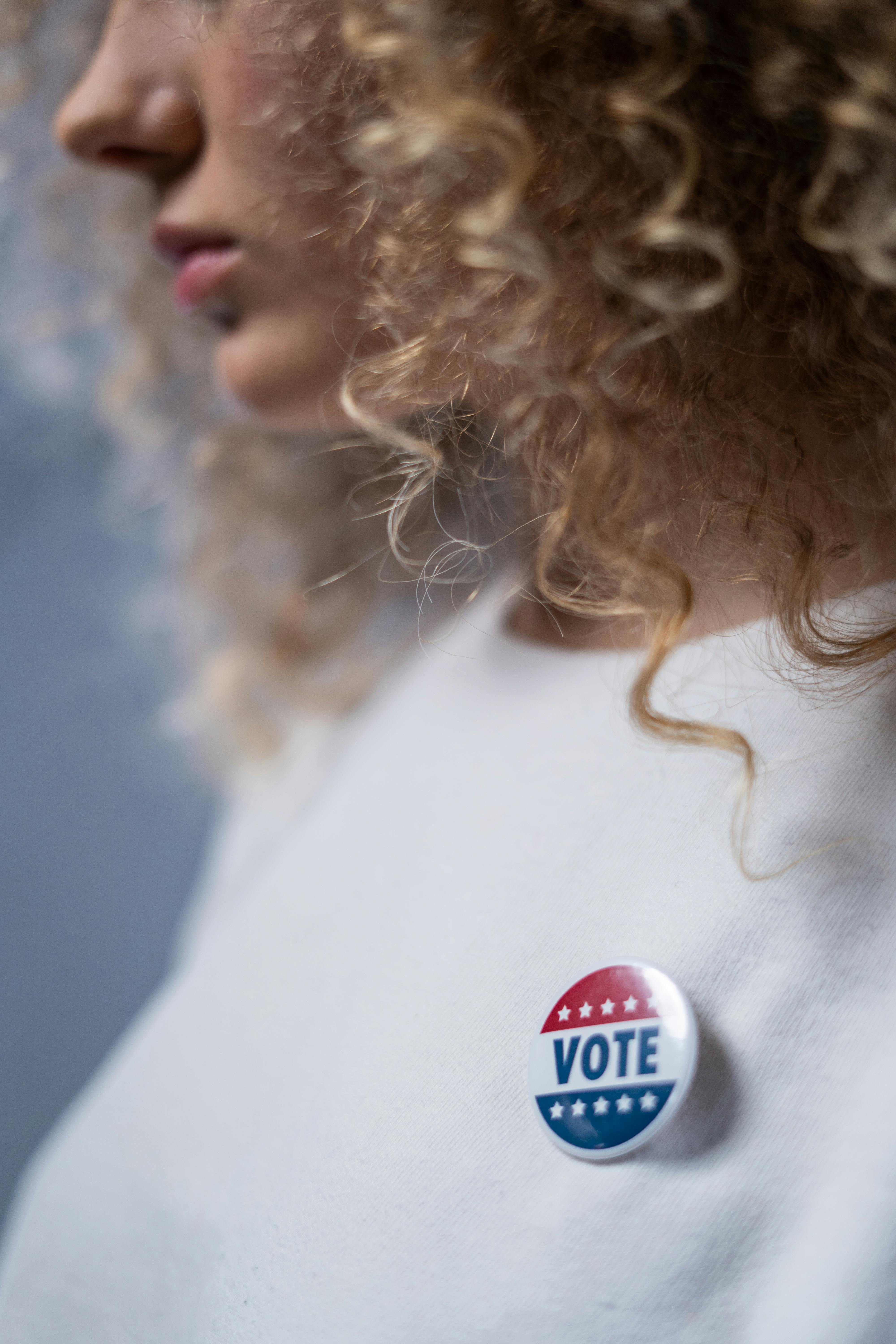 woman who has a voting sticker