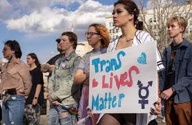 Individuals gathered to show support for gender-affirming care for Trans Youth