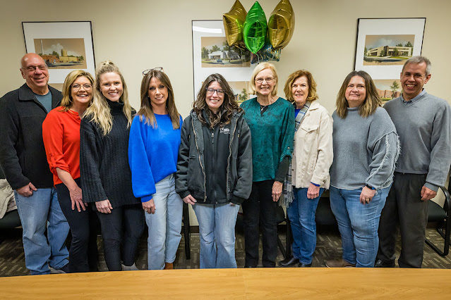 Hilary Steinman is pictured in the center with Habitat for Humanity of Nodaway County board members. 